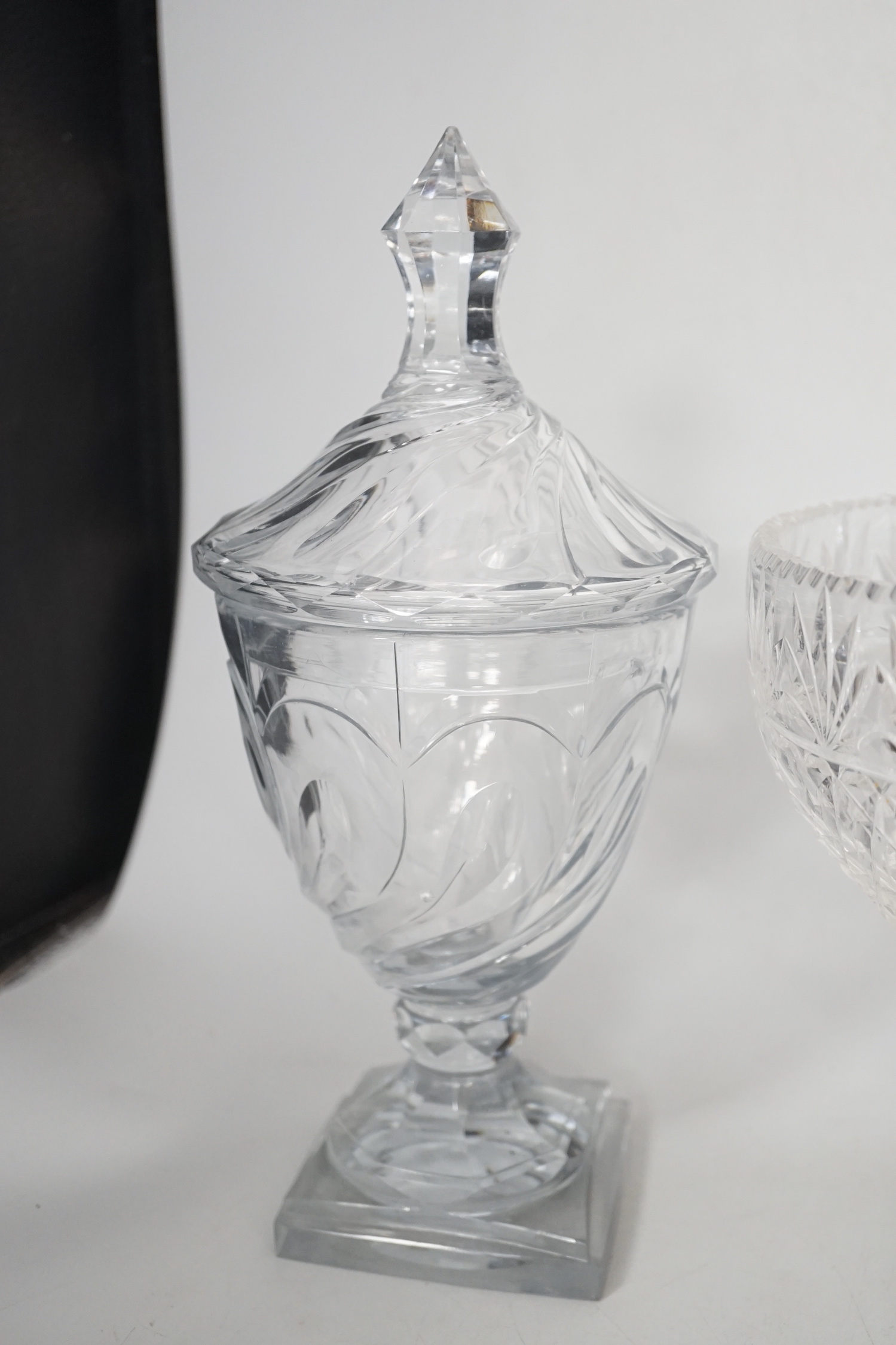 A pair of Regency Irish cut glass sweetmeat vases and covers, 30cm high and an Edwardian cut glass pedestal vase (3)